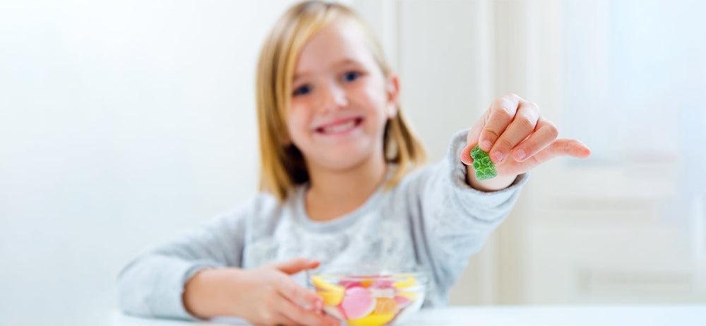 A happy girl choosing the best multivitamins for growing kids
