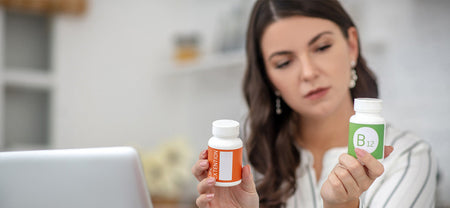 A lady reading nutrition facts label on supplements bottle for healthy eating and understanding nutrition facts