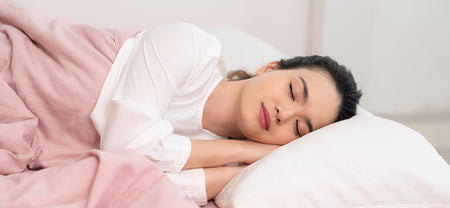 A lady sleeping soundly with the help of melatonin that helps enhance the sleep quality | Melatonin Supplement