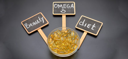 A bowl contains omega 3 fatty acids capsules to help maintain your diet and beauty