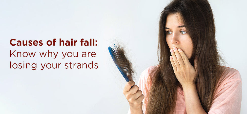 A girl facing hair fall problems, faces hair loss while combing her hair 