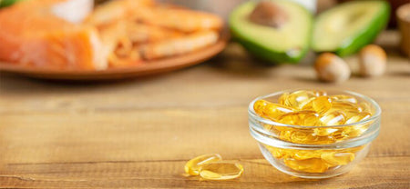 A bowl containing Omega 3 fish oil capsules to support heart and liver health that will help for overall health benefits. 