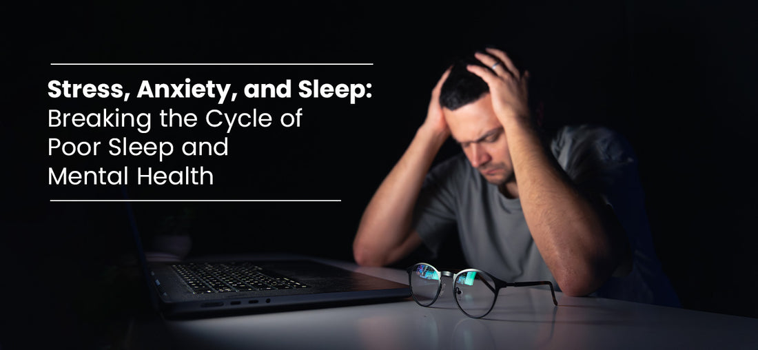 A man holding his head in anxiety and stress with laptop screen open in front of him 